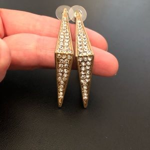 Gold and rhinestone earrings.